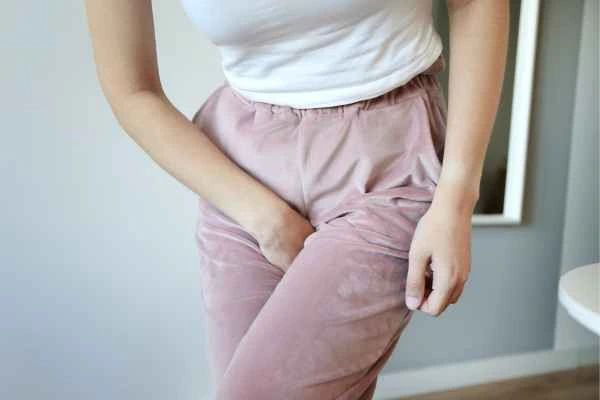 woman running for the toilet because of urinary incontinence Hounslow